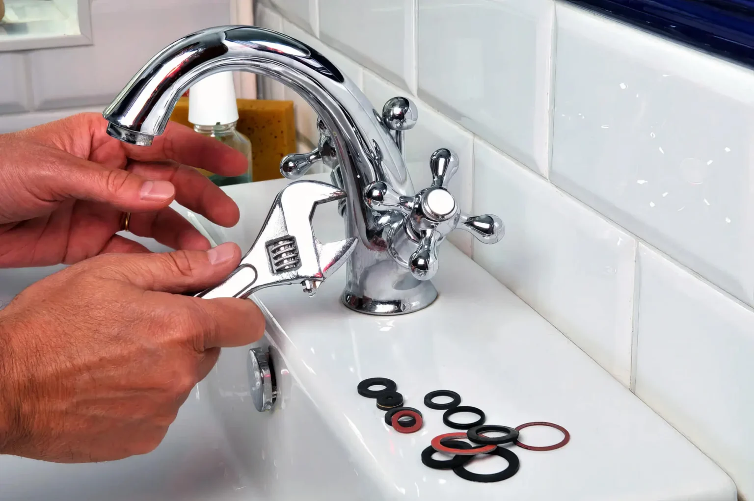 Plumber maintaining a bathroom faucet in Davis